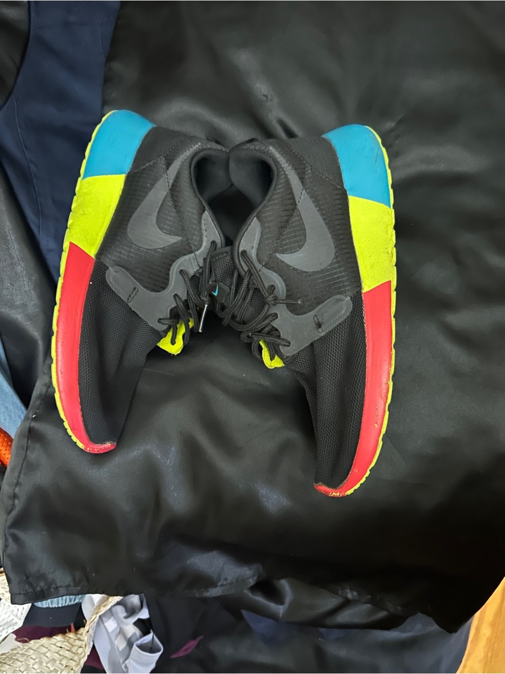 Nike Black Sneakers with Blue, Yellow and Pink Sole Accents
